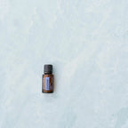 ZenGest doTERRA 15ml — frasco sobre fundo mármore azul, óleo essencial digestivo puro CPTG, aromaterapia