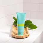 Loção Corpo e Mãos SPA doTERRA — frasco branco em bancada com flores, hidratação natural CPTG