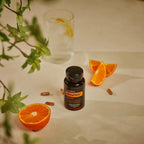 MetaPWR Mito2Max doTERRA gomos laranja vaso água planta fundo bege, energia vitalidade natural