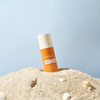 Protetor Solar Mineral Hidratante doTERRA SPF30 — frasco com areia, conchas e fundo azul, praia Portugal CPTG