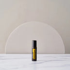 Helichrysum Touch doTERRA Roll-on 10ml — frasco em fundo pastel minimalista, aromaterapia restauradora CPTG