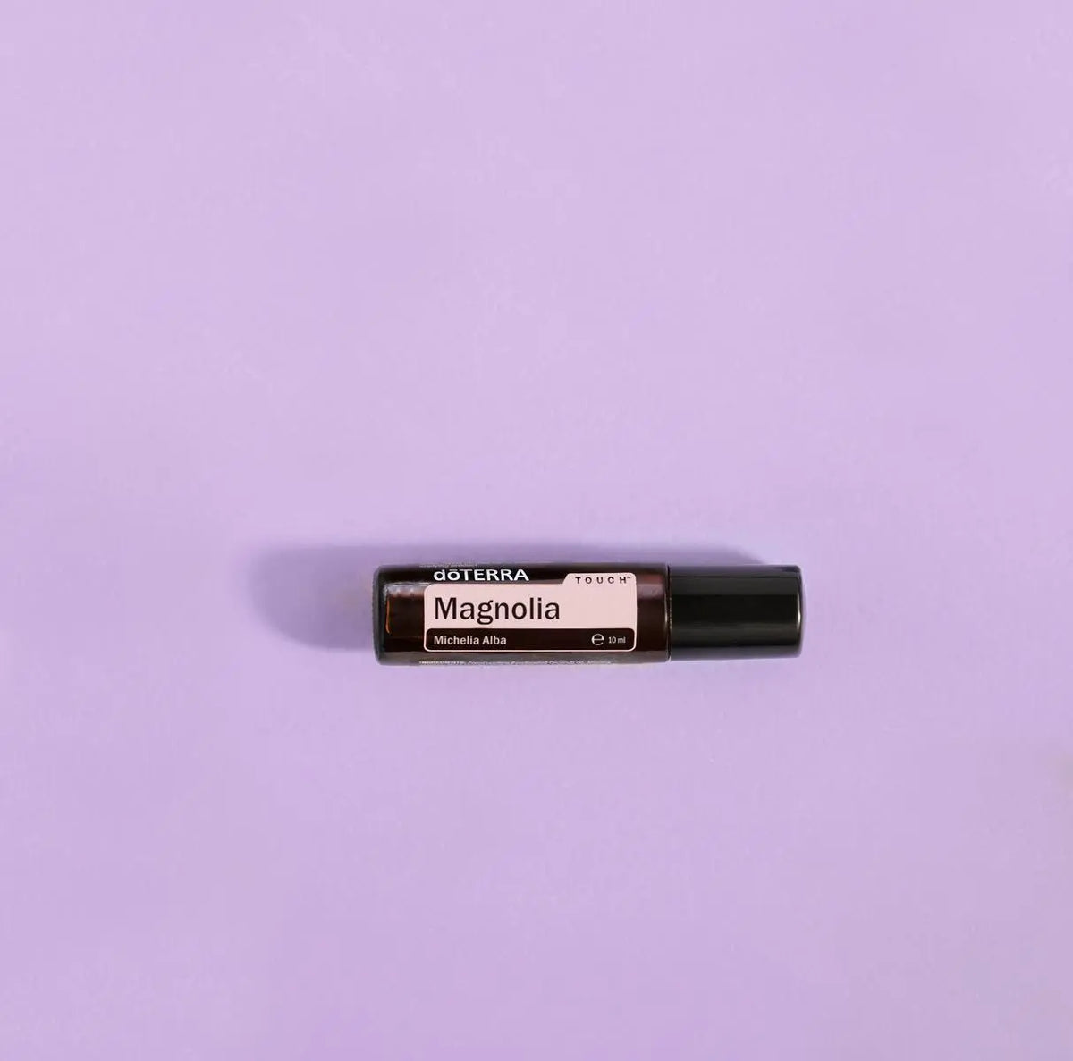 Roll-On Magnólia Touch doTERRA 10ml — fundo lilás lavanda minimalista, aromaterapia doTERRA Portugal