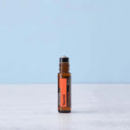 Roll-On Neroli Touch doTERRA 10ml — frasco em mármore branco fundo azul claro, aromaterapia neroli doTERRA Portugal