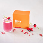 MetaPWR Advantage doTERRA cereja-romã — saqueta junto a vaso com bebida preparada, suplemento colágeno metabolismo